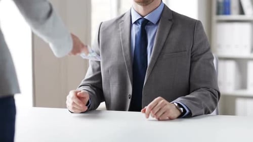 Closeup Shot Of Businessman Taking Money Bribe From Woman At Office
