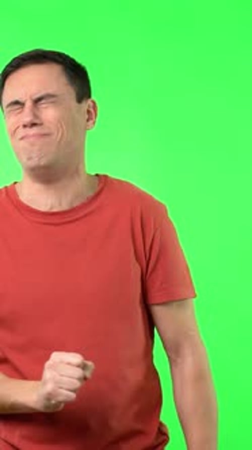 Man Coughing Against a Green Screen