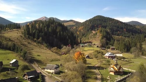 Aerial View of Autumn Mountain Landscape with Evergreen Pine Trees and Yellow Fall Forest with