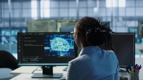 Woman Working on AI Project in Modern Office