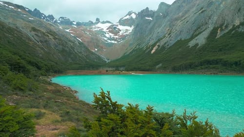 Aerial View on Emerald Lake in the Andes Mountain Forest in Rainy Day Chile