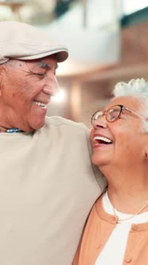 Senior Couple Laughing Together Outdoors on a City Street