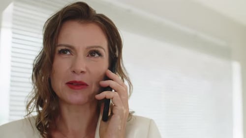 Woman Speaking on Phone, Indoors Close Up