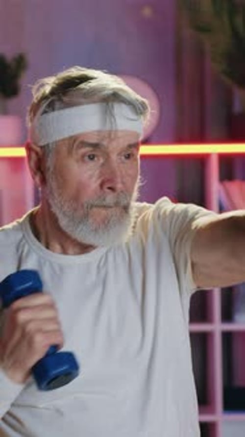 Senior Man Doing Arm Workout with Dumbbells