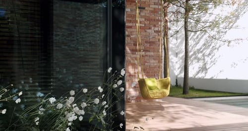 Modern Home Garden with Hanging Rattan Chair and Brick Detail