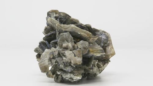 Extremely close view of Muscovite crystal formation. Rotating completely. Looping