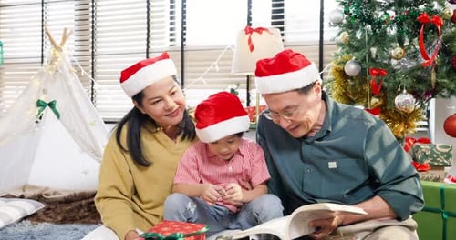 Family Reading Book Together at Christmas Time