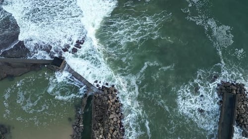 Flying Close To Shore Over A Pier In Portugal