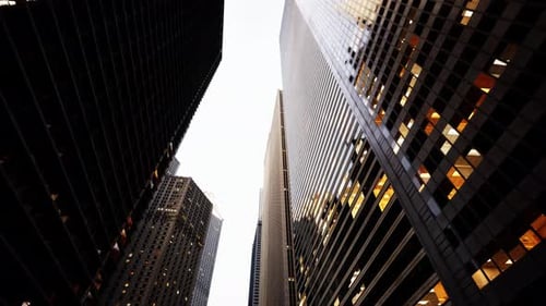 Urban Giants Gazing Skyward Amidst New York Citys Majestic Skyscrapers