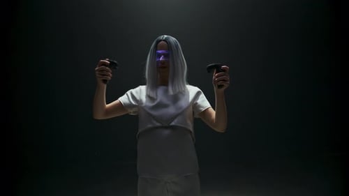 Young Woman Using Virtual Reality Controllers in Studio