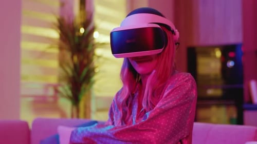 Woman Experiencing Virtual Reality with VR Headset at Home