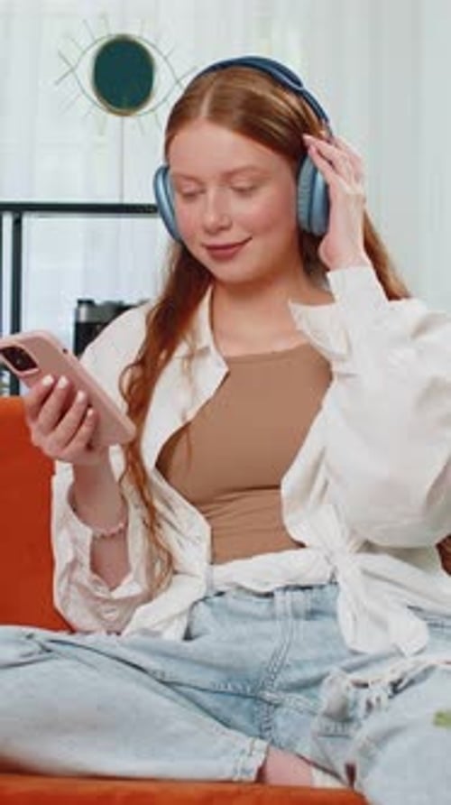 Woman Listening to Music on Phone Indoors