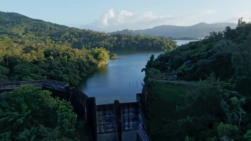 Aerial approaching shot of Hatillo Dam with picturesque seascape landscape of Dominican Republic. Tr
