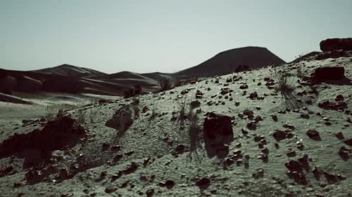 Arid Terrain with Rocky Formations Under a Clear Sky in Mongolias Landscape