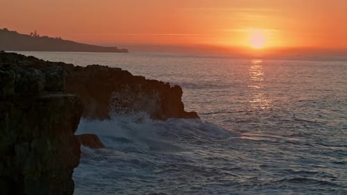 Golden Sunrise at Rocky Ocean Coast. Ocean Waves in . Mountain