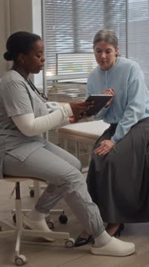 Female Doctor and Patient Reviewing Test Results in Clinic