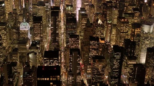 A Breathtaking Aerial Night View of a Vibrant Cityscape Filled with Numerous Lights and Energy