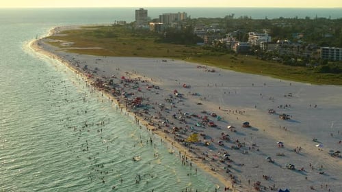 View From Above of Evening Siesta Key Beach with White Sands Full of Tourists in Sarasota USA Many
