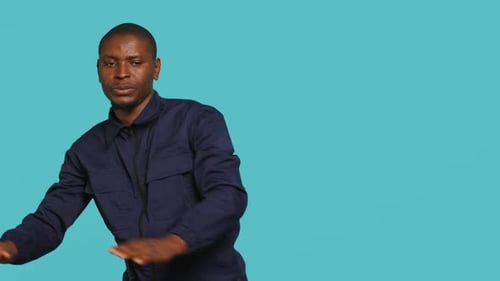 Man in Blue Jacket Pushing with Palms Up