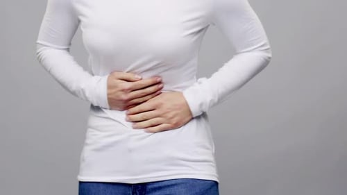 People, Healthcare And Problem Concept - Woman Suffering From Stomach Ache