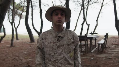 Soldier Stands At Attention Saluting The General In The Woods With Trees