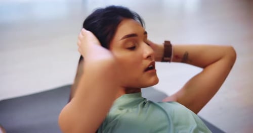 Woman Does Crunches On Yoga Mat Close Up