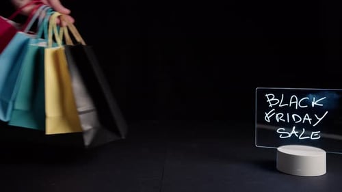 Elegant Shopping Bags with Black Friday Sale Sign