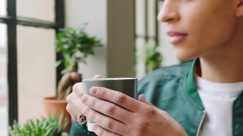 Thinking man, drinking coffee and relax at window loft apartment in peace