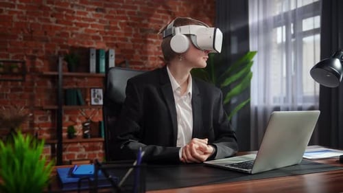 Business Professional Using Virtual Reality Headset in Office