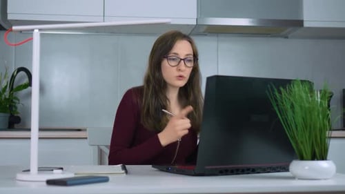 Businesswoman Emotional Talking Conference Video Call on Laptop Working From Home Office