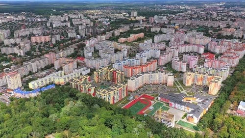 Modern city district near the forest. New apartment buildings of residential complex.
