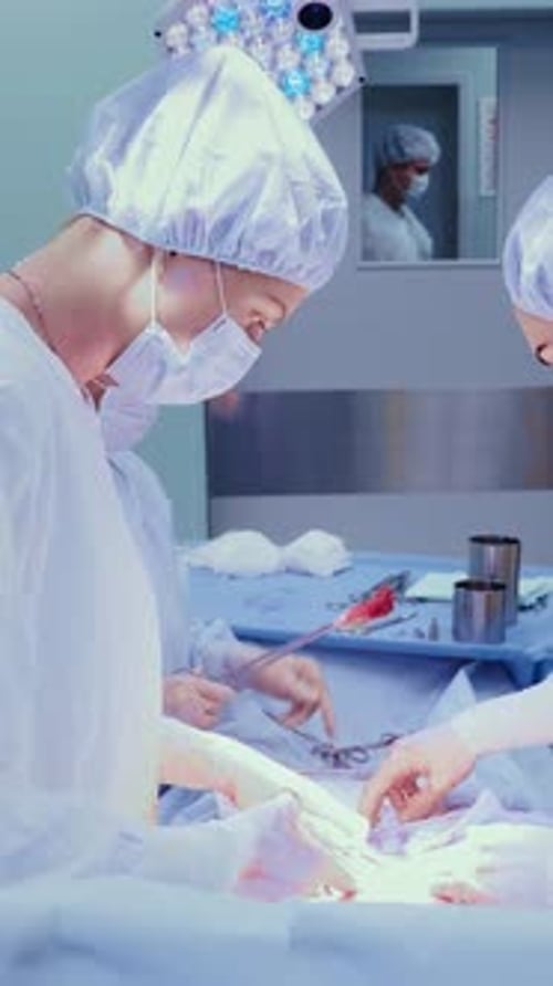 Surgeons Performing Operation in Hospital Operating Room