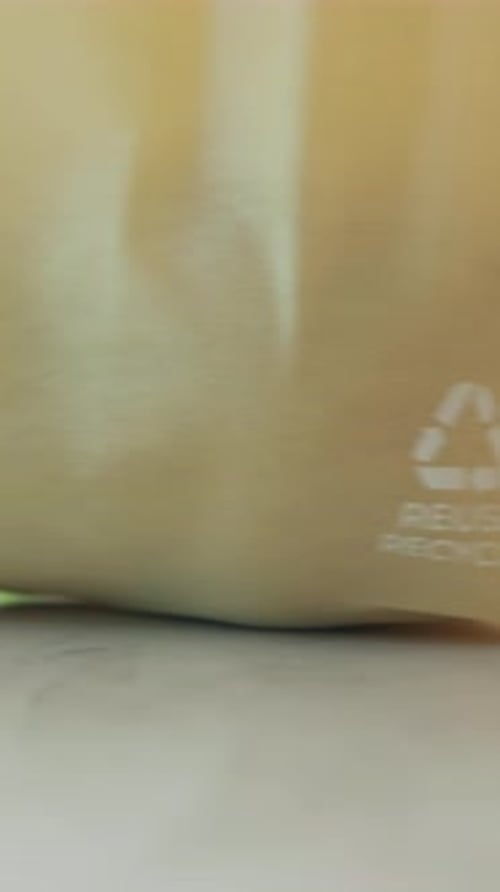 Recycling sign, grocery bag and arrow in home for eco friendly shopping