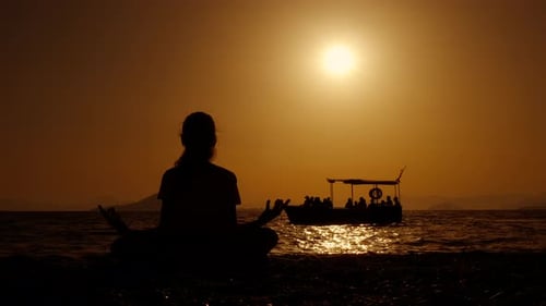 Meditative Silhouette at Sunset on Tropical Beach
