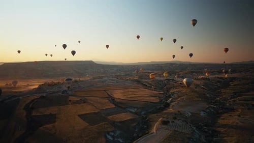 Hot Air Balloons Flying Over Cappadocia at Sunrise