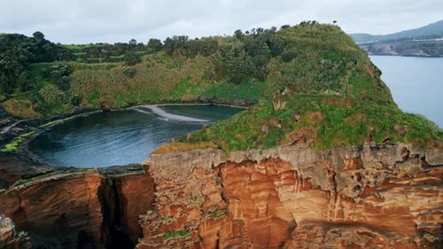 Drone Green Island Lagoon Cliff View Rocky Coastline with Green Lush Vegetation