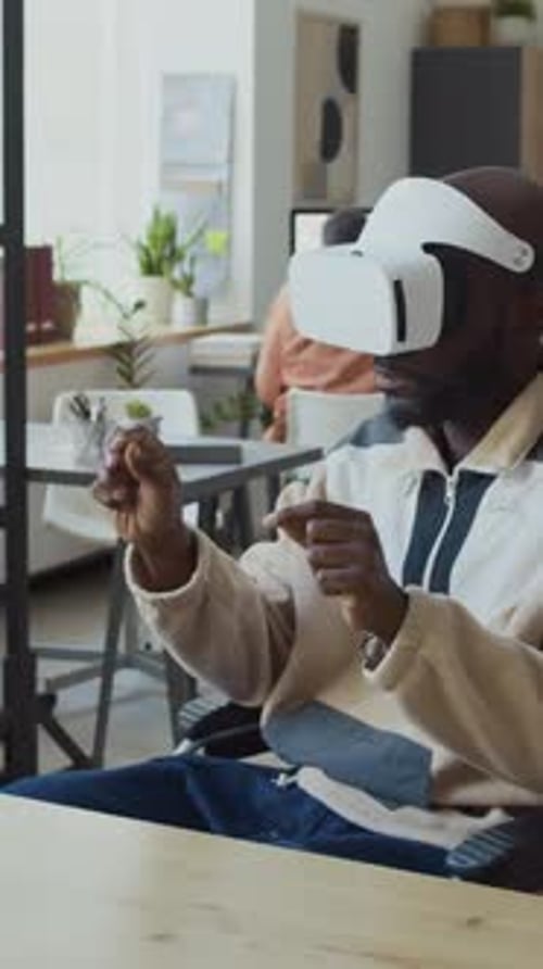 Man Wearing VR Headset in Office Environment