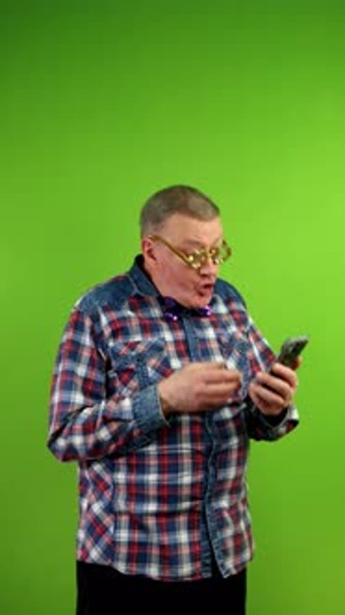 Man Reacts to Smartphone on Green Screen