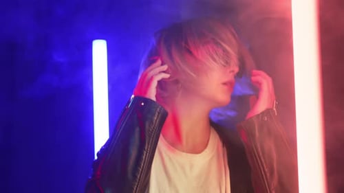Stylish Young Adult Posing with Moody Lighting