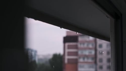 Rain Drops Flowing Down Window on Overcast Day