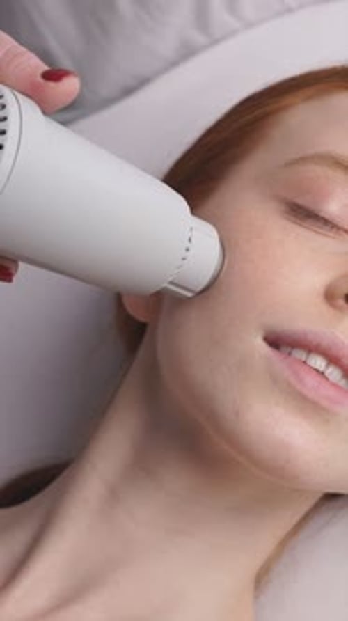 Young Woman Receiving Facial Beauty Treatment