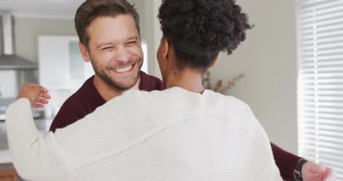 Loving Couple Embracing Indoors, Happy at Home
