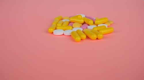 Colorful Pills on Peach Background