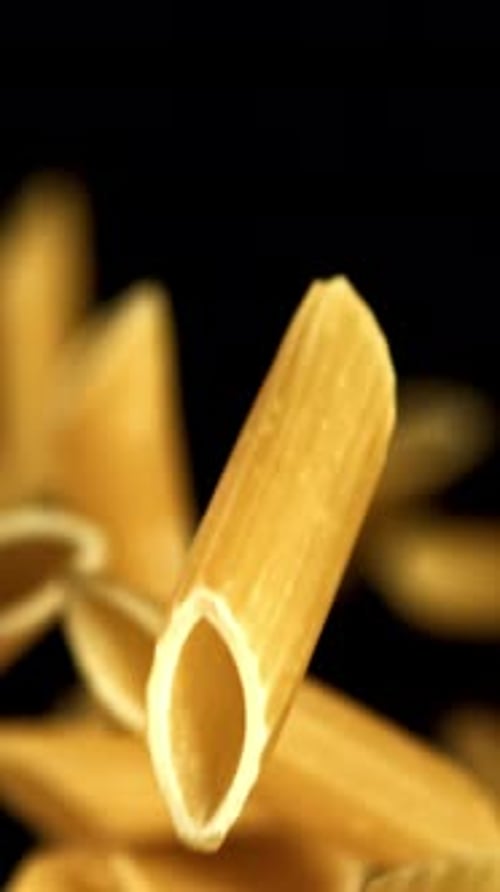 Super Slow Motion Flying Dry Penne Pasta Filmed on a Highspeed Camera at 1000 Fps