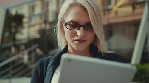 Portrait Attractive Young Business Woman with Glasses Use Tablet Computer Smile Outdoor Street
