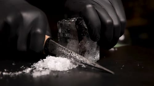 the bartender prepares a cocktail at the bar