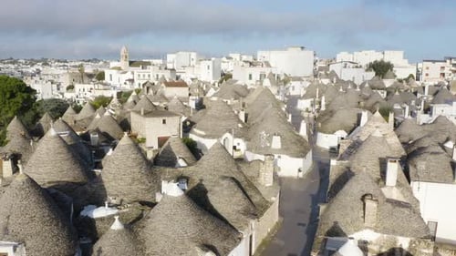 Ascending Shot Reveals Famous Conical Houses in Alberobello, Southern Italy