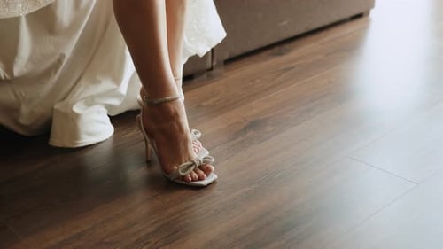 Elegant Woman in Wedding Dress Wears High Heel Shoes