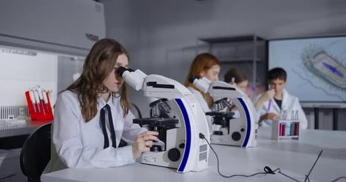 Young Students In Biology And Chemistry Classroom Of Modern School Education And Learning
