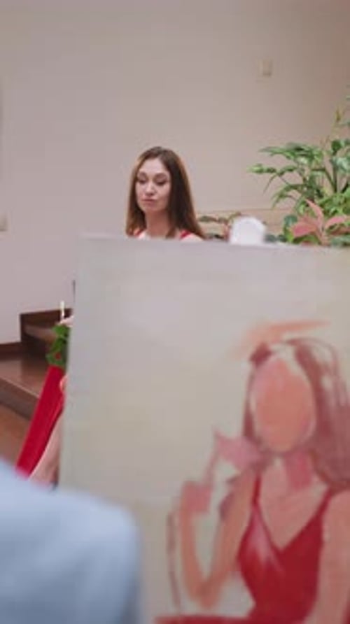 Artist Draws Young Woman Figure in Gallery